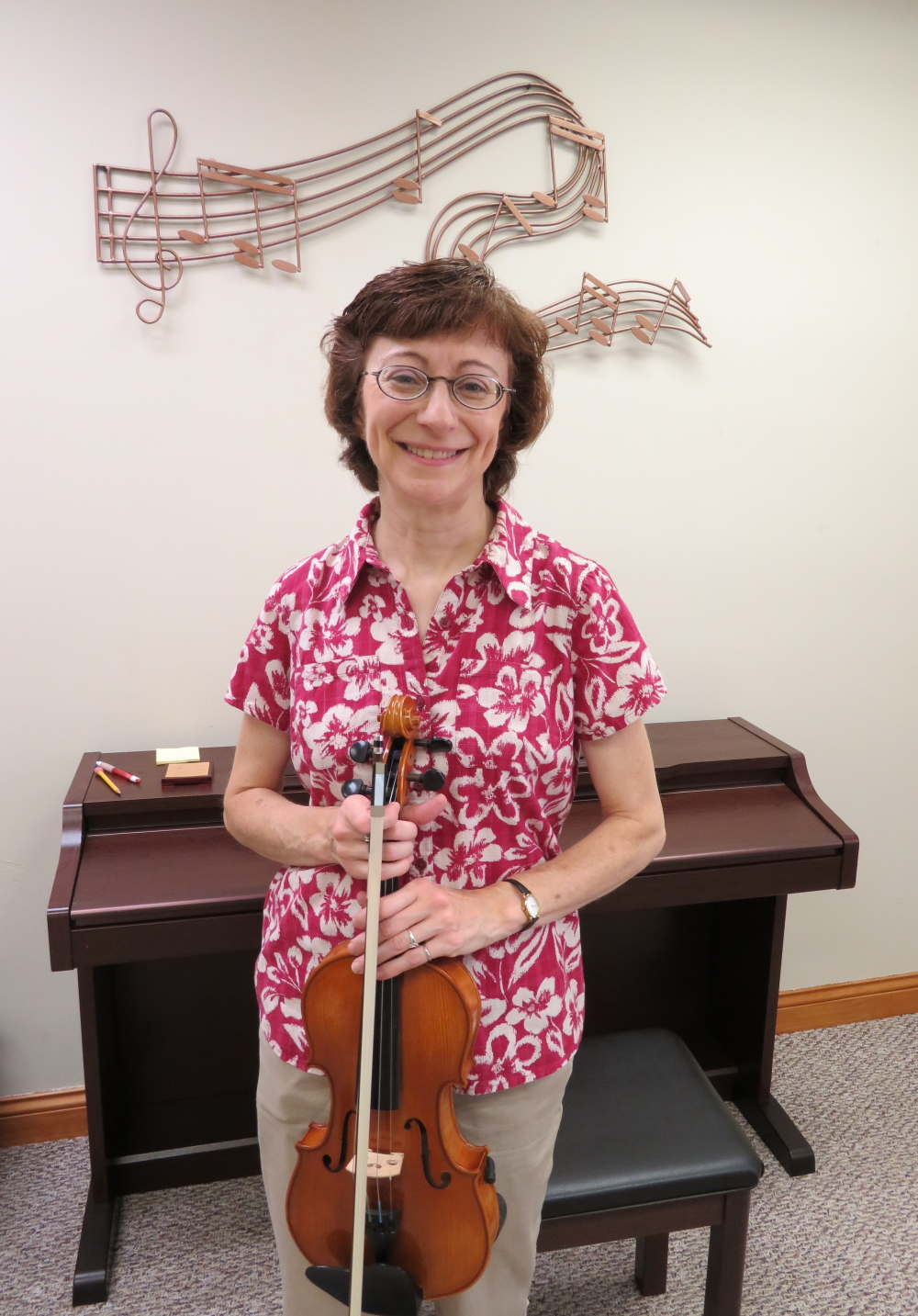 Ann in front of her piano